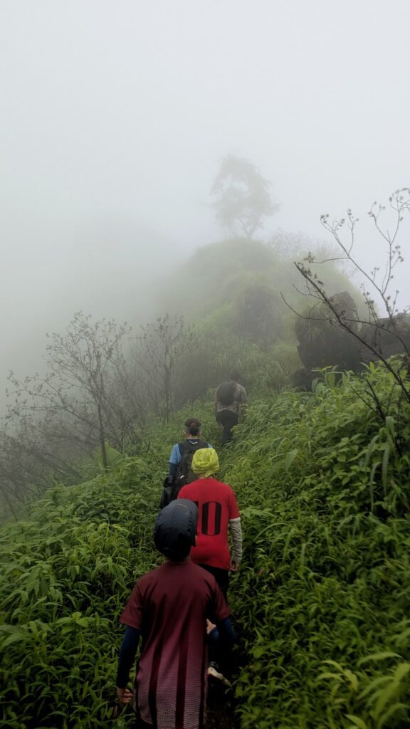 group trekking on monsoon trail near Mumbai